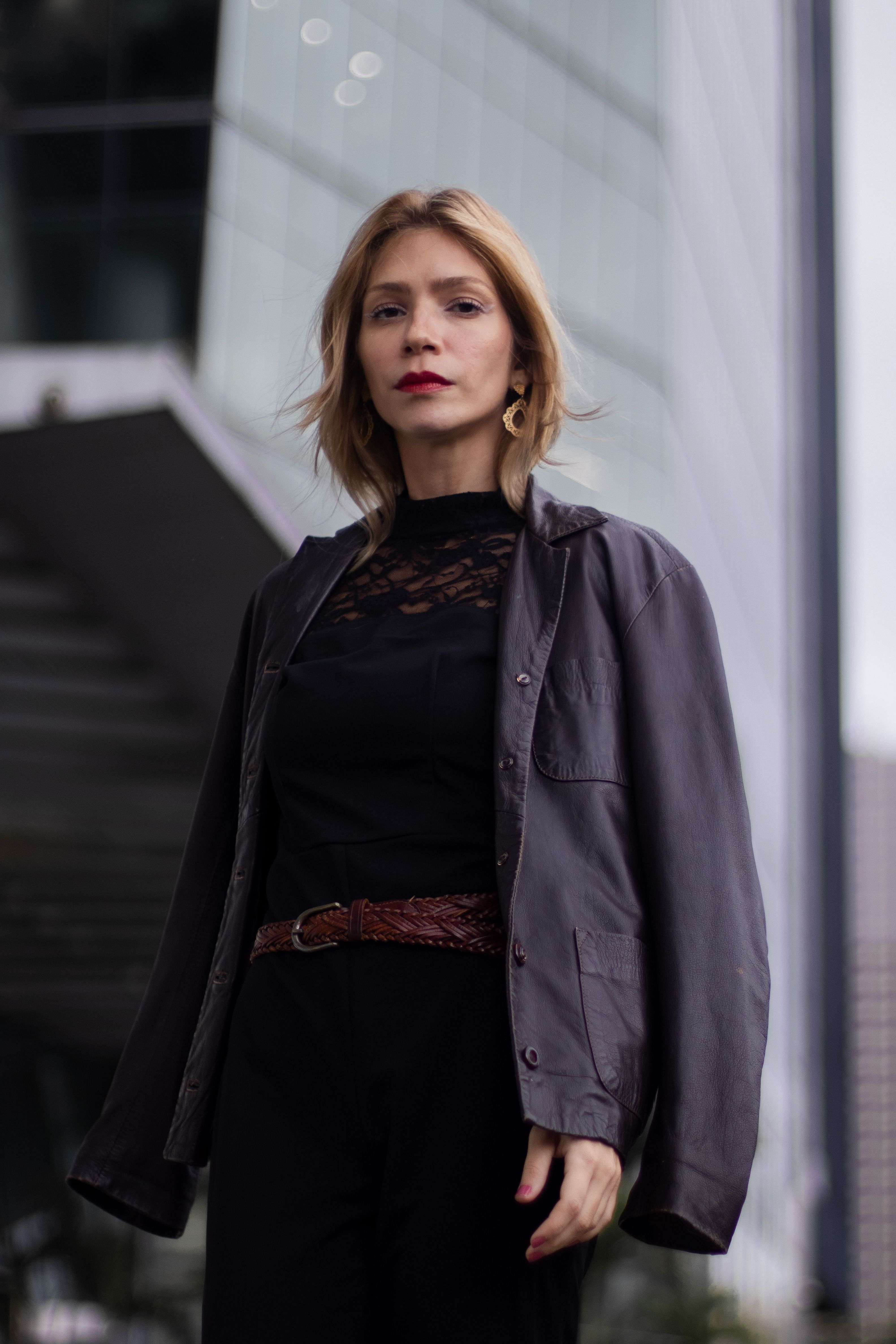 Standing Woman in Black Leather Jacket · Free Stock Photo