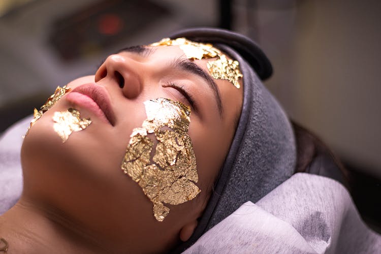 Woman With Mask On Face At Beautician