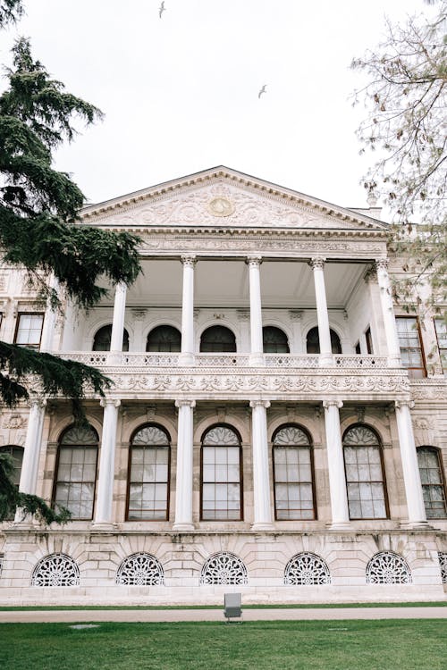 A large building with a white roof and columns