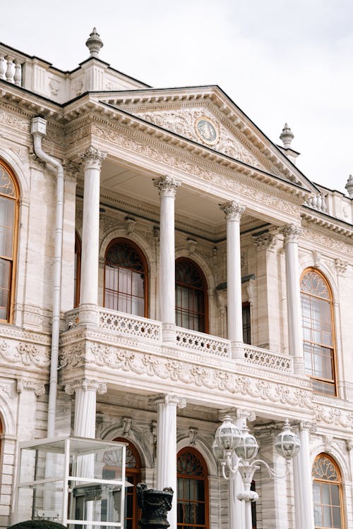 A large building with columns and a clock