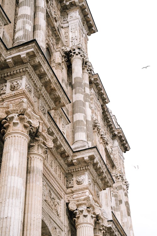 The top of a building with ornate columns