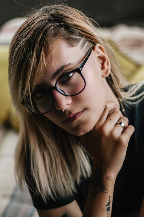 Close-up Photo of Woman Wearing Eyeglasses Posing
