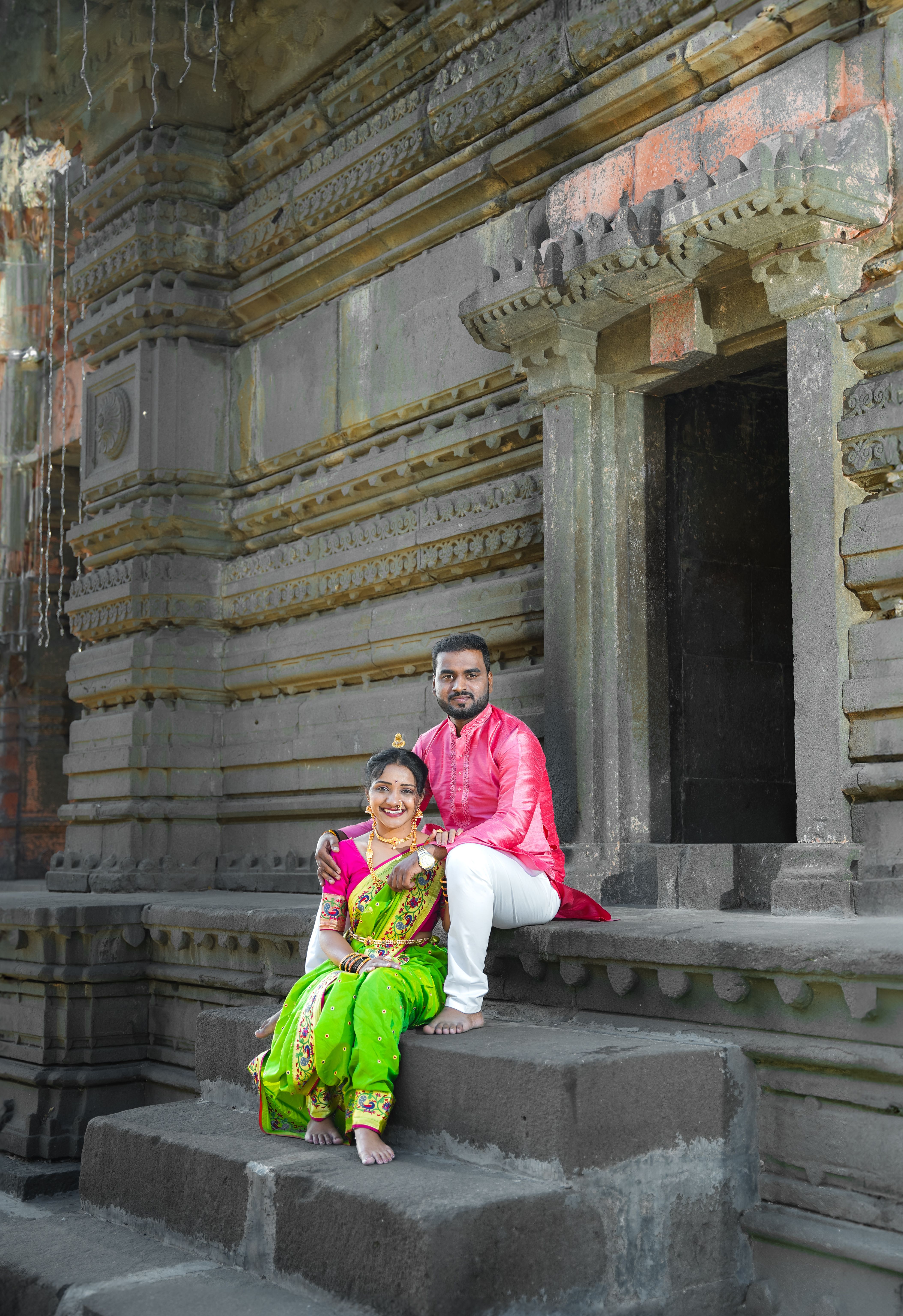 Couple in Traditional Clothing Sitting on Stairs · Free Stock Photo