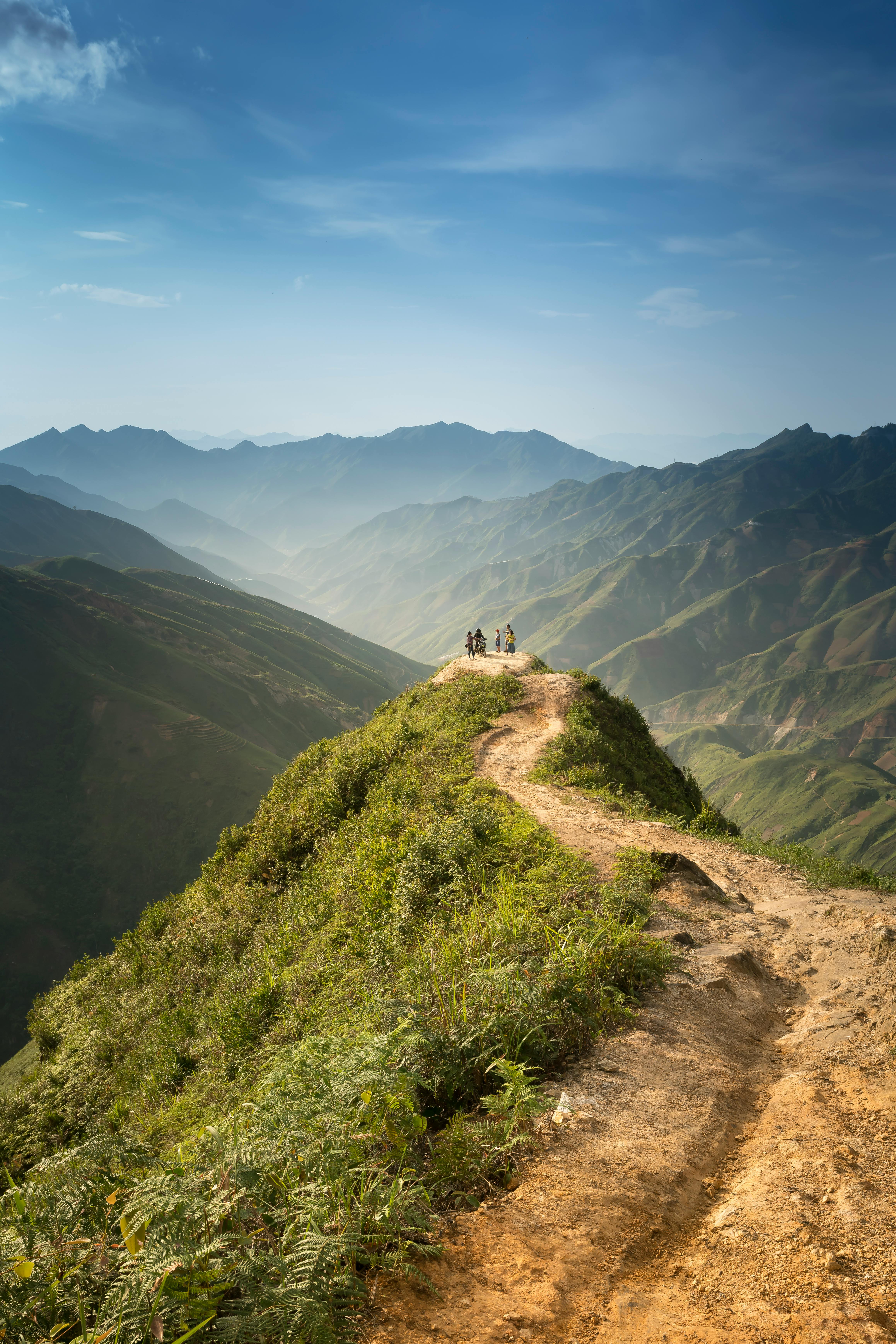 people standing on cliff