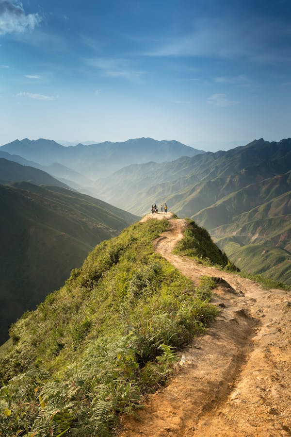People Standing on Cliff