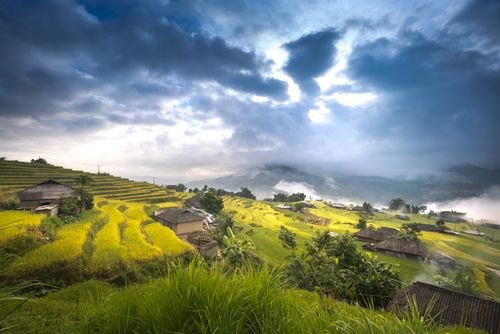 Free Beautiful landscape of rice terraces under dramatic clouds in rural countryside. Stock Photo