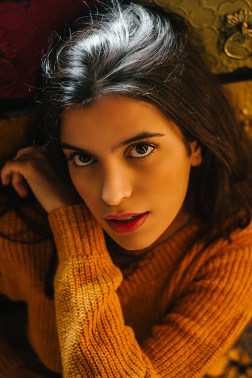 Close-up Photo of Woman in Mustard Sweater Posing