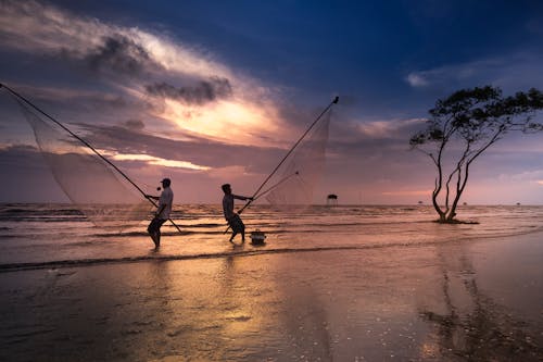 Two Men Holding Nets