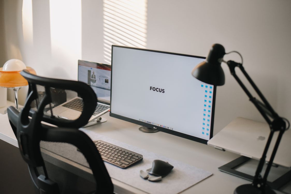 Computer Screen At Work Monitor on an Office Desk · Free Stock Photo