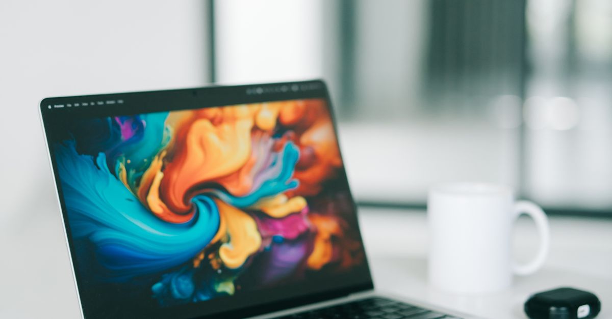 Laptop on a White Table · Free Stock Photo