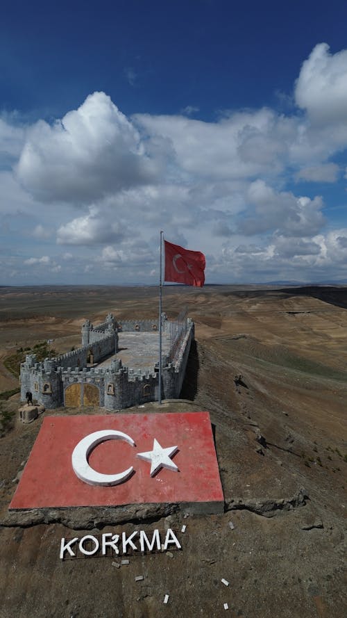 A flag is flying over a castle in turkey