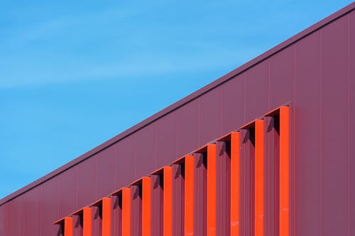 A close up of a red building with blue sky