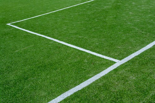 A soccer field with white lines on it