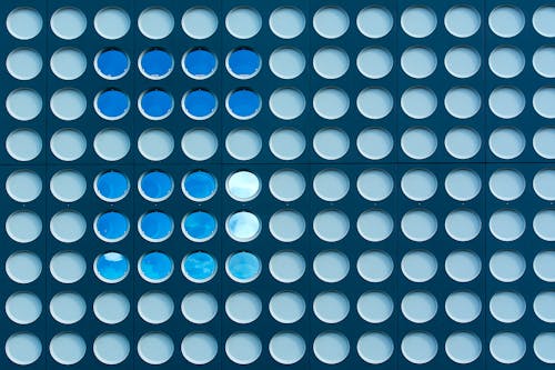 A blue and white circle pattern on a blue background