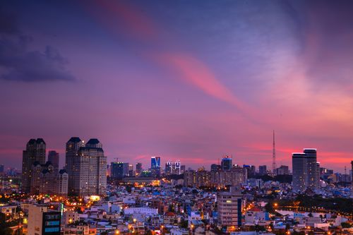 Free Urban skyline with vibrant city lights and skyscrapers at twilight. Stock Photo