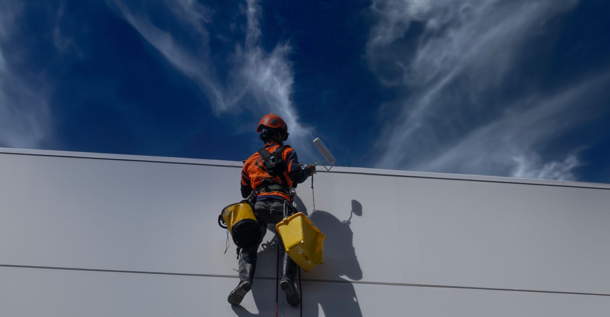 A painter at work on a building in Auckland