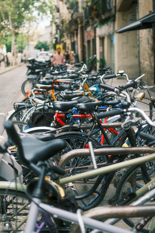 Free A vibrant scene of bicycles parked along a street in Barcelona, Spain, showcasing urban life. Stock Photo
