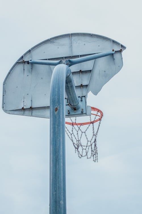 A basketball hoop with a net and a basketball