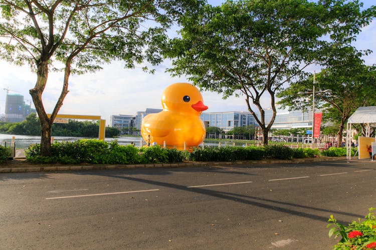 Giant Yellow Rubber Ducky On Body Of Water At Park