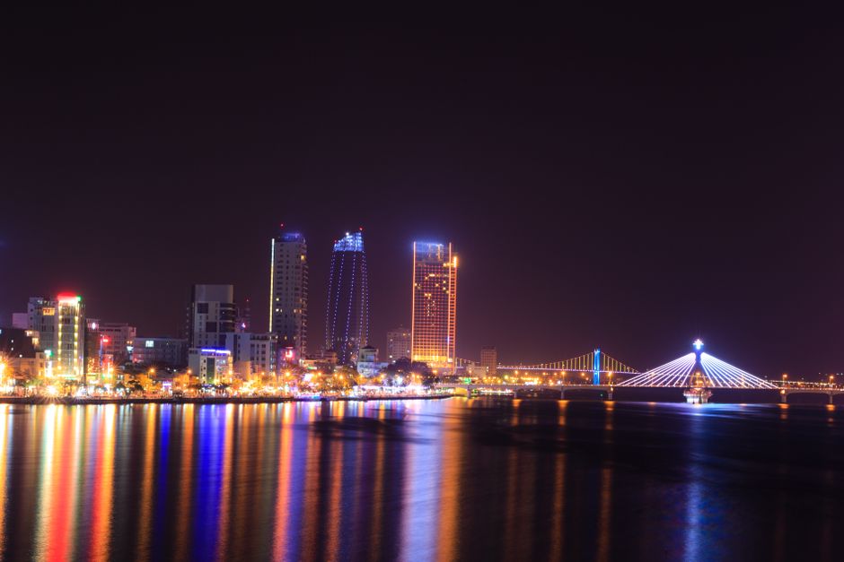 Illuminated Manama skyline with hotels at night in Bahrain