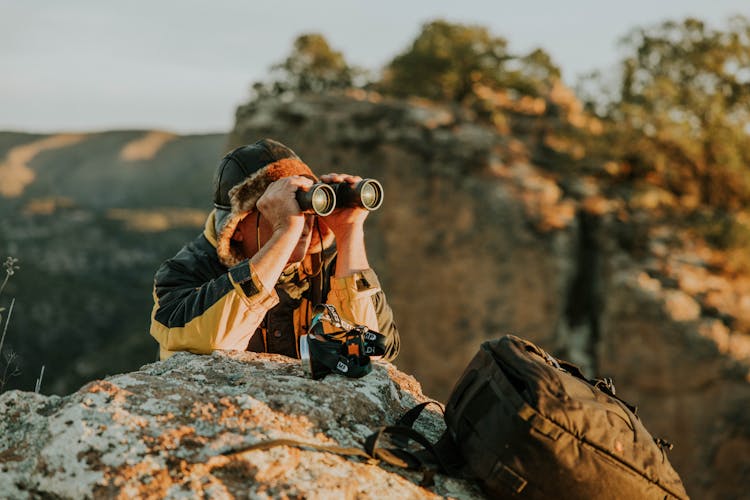 Woman With Binoculars On A Desert 