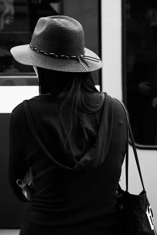 Free Greyscale Photo of a Woman Wearing a Hat Stock Photo