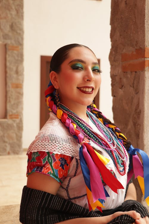 Free A woman in a mexican dress with colorful hair Stock Photo