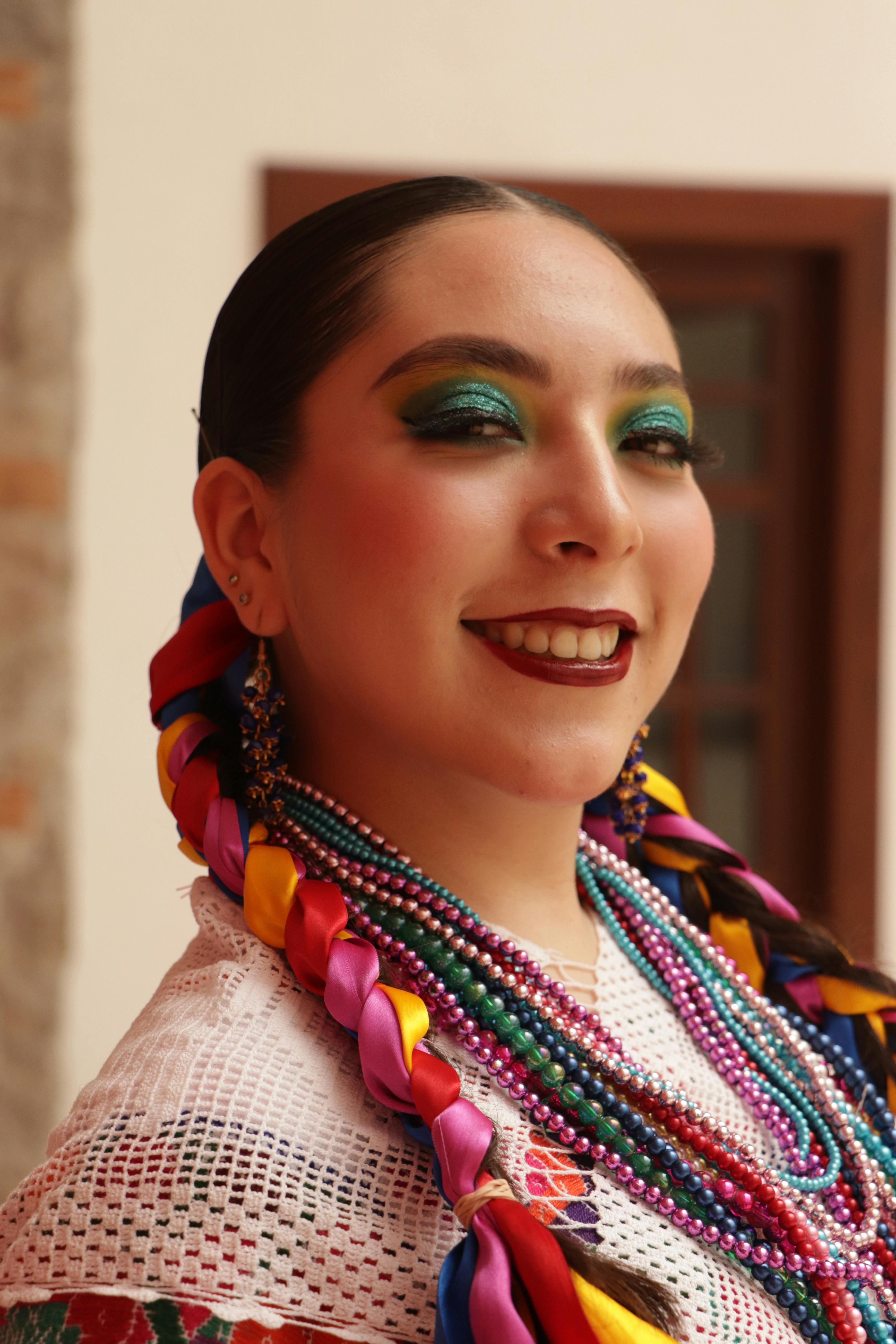 a woman with colorful makeup and colorful hair