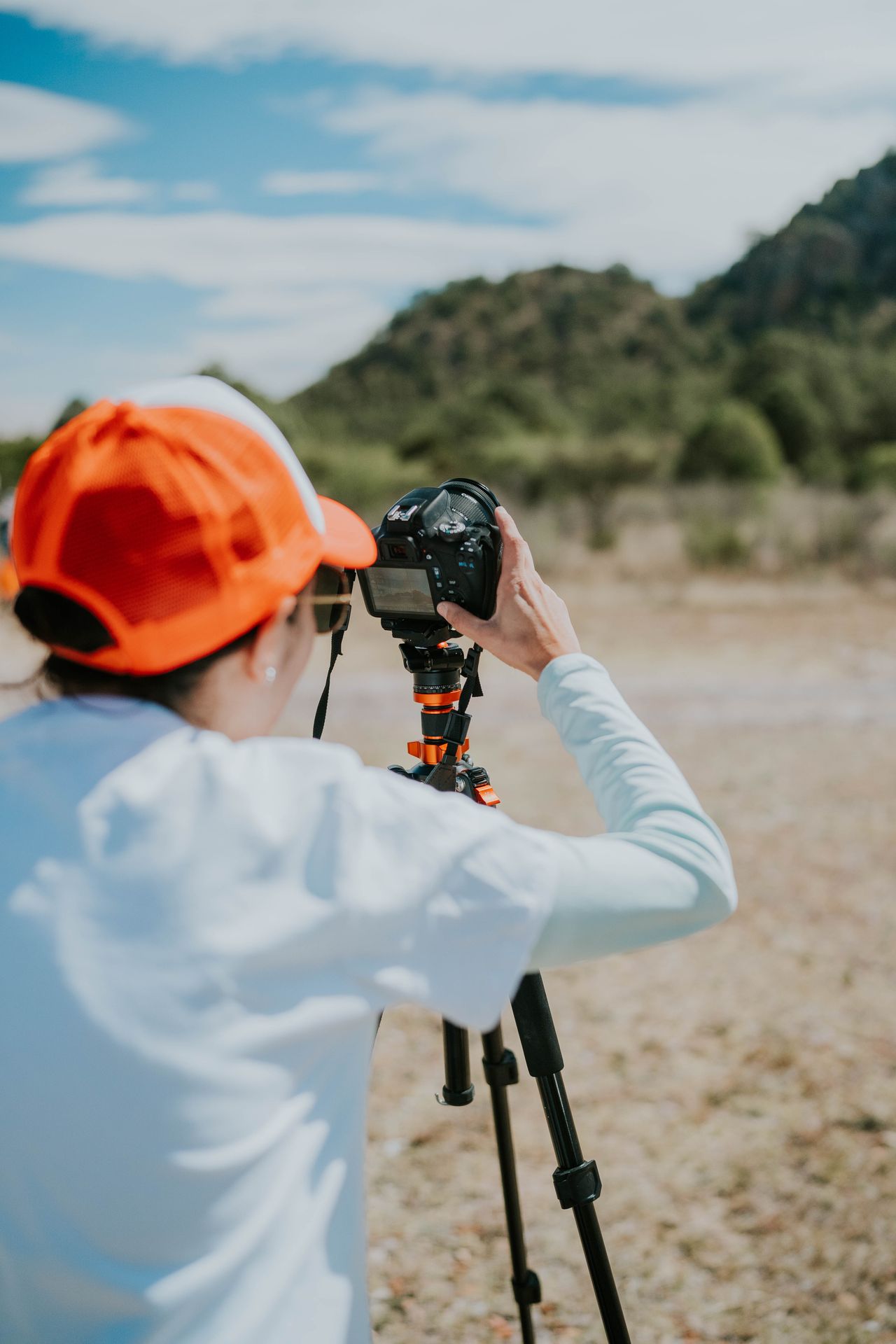 Photographer with camera on a beach