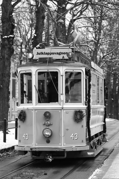 Free Monochrome photo of a vintage tram on a snowy street in Gothenburg, Sweden. Stock Photo