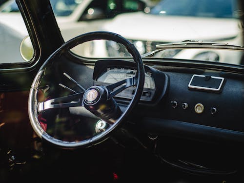 A close up of the steering wheel of a car