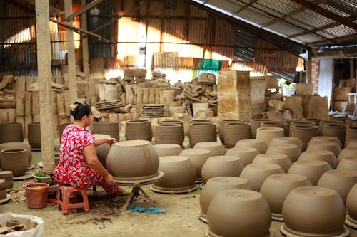 Woman Making Pots