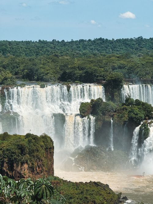 Free Breathtaking view of Iguazu Falls cascading over lush vegetation, a natural wonder in Brazil's jungle. Stock Photo