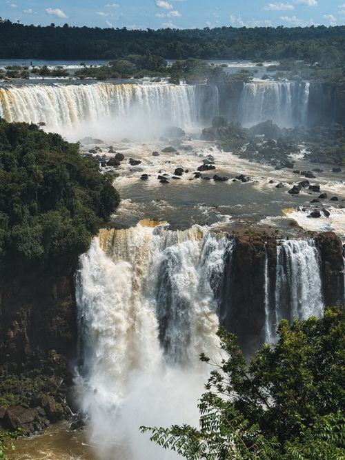 Free Stunning view of Iguazu Falls cascading through the lush Brazilian rainforest. Stock Photo