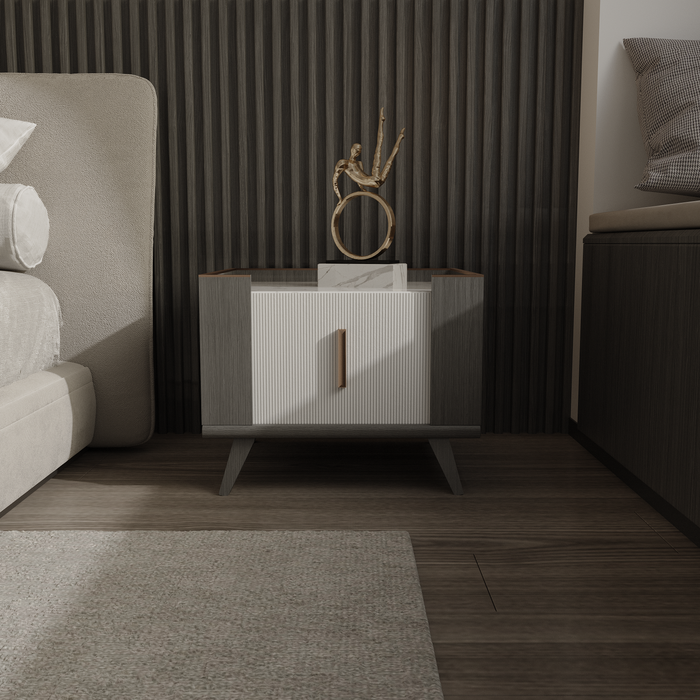 Fluted bedside cabinet beside a low bed — photo by Rodrigo Neto on Pexels