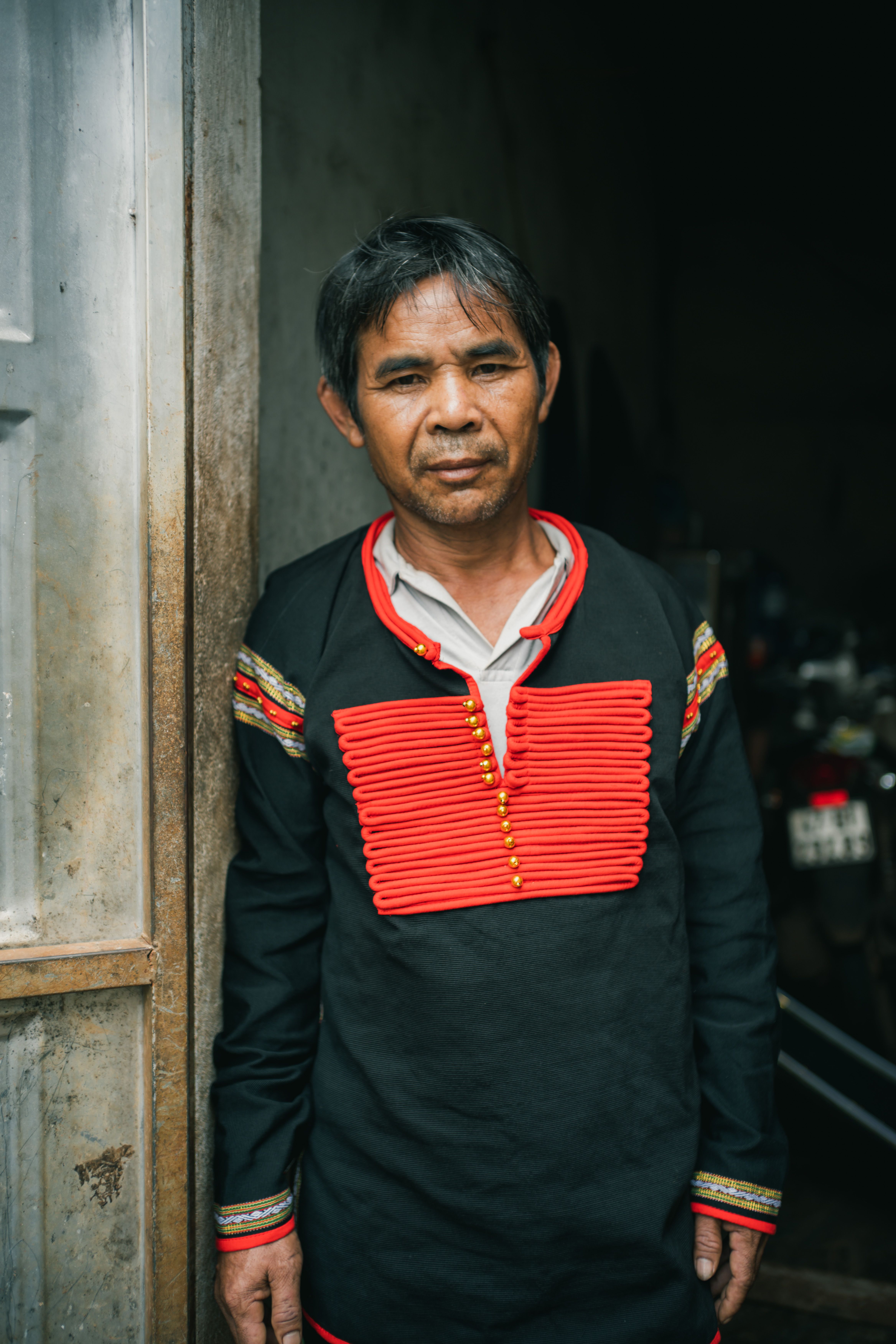 Portrait of a Montagnard man in traditional attire, Buon Ma Thuot, Vietnam.