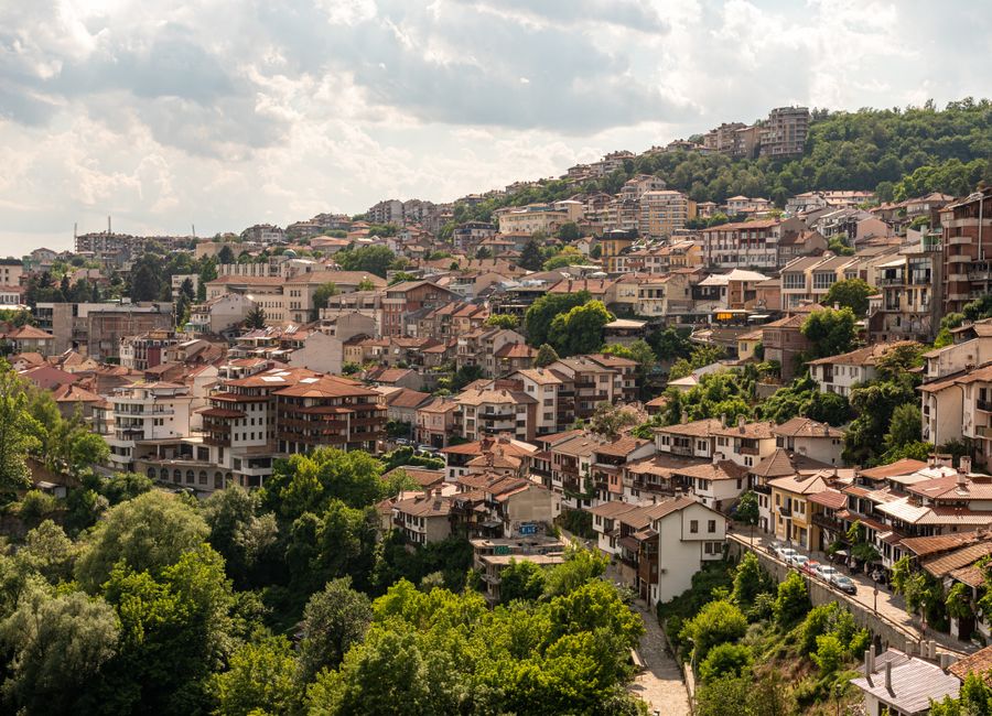 A picturesque aerial view of Veliko Tarnovo, Bulgaria, showcasing its unique architecture and lush greenery.