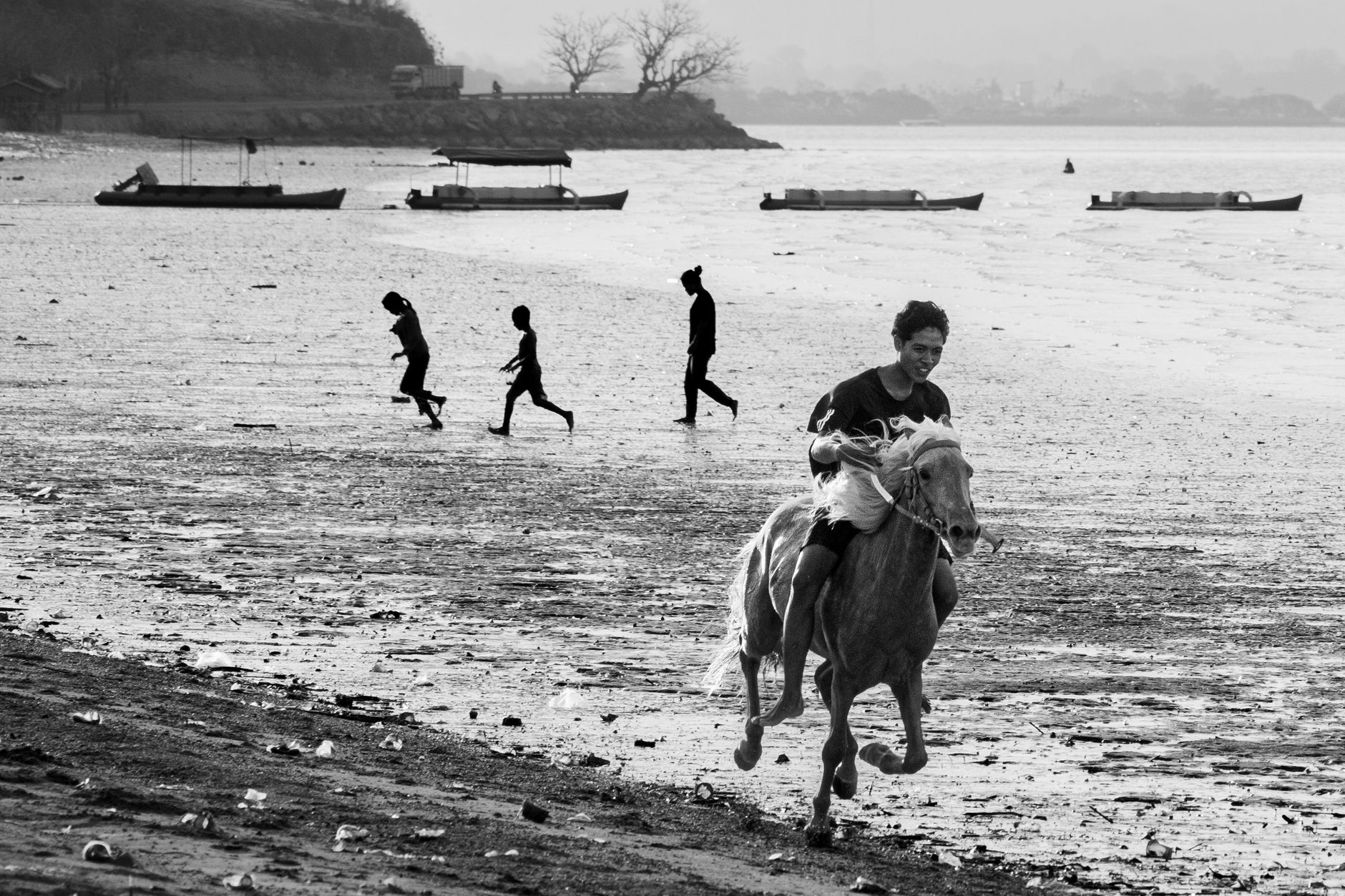A person riding a horse on a scenic beach in Bima, West Nusa Tenggara, Indonesia.