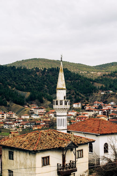 A view of a town with a mosque on top