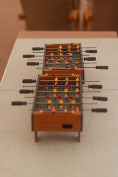Close-up of a miniature table football game indoors in Krynica-Zdrój, Poland.