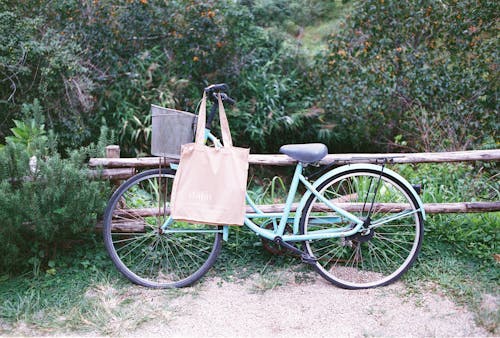 A bicycle with a bag on the back