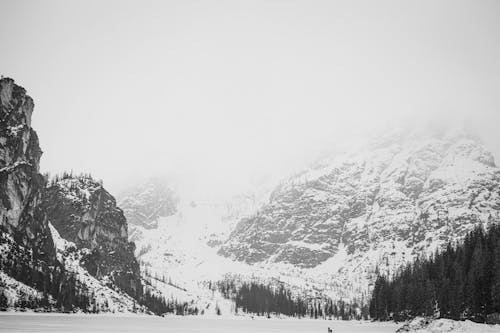 A black and white photo of a snowy mountain