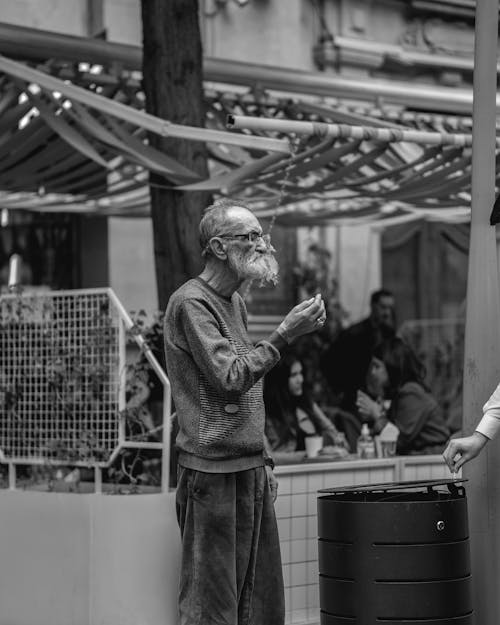 A man and woman talking to each other in a black and white photo