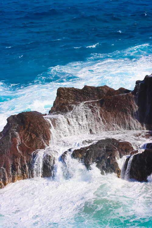 Free Stunning view of waves crashing against rocky shoreline in Honolulu, Hawaii. Stock Photo