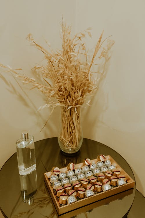 Free Truffles, Plant and Perfume on Table Stock Photo