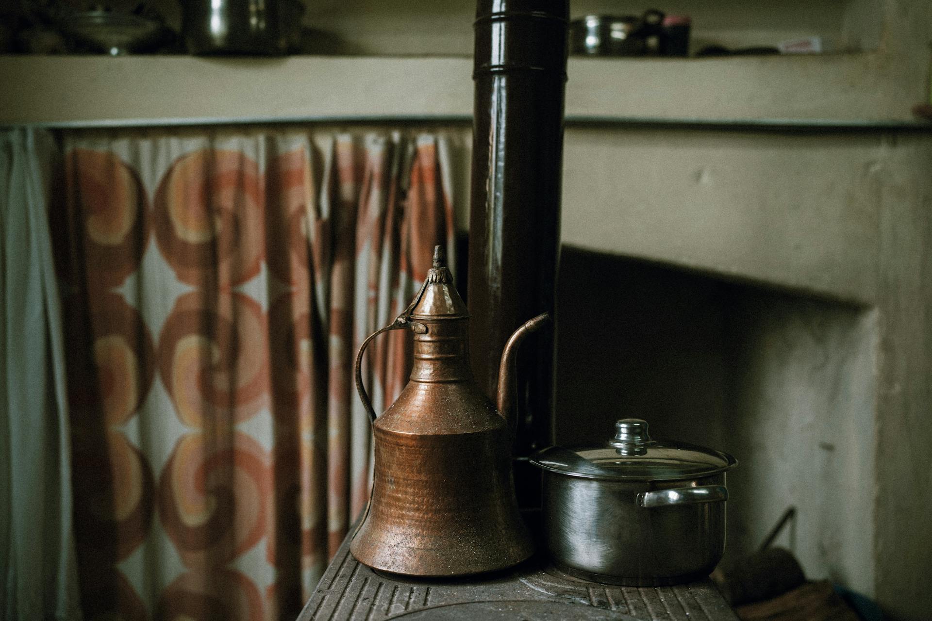 Old Kettle and Metal Pot in Kitchen