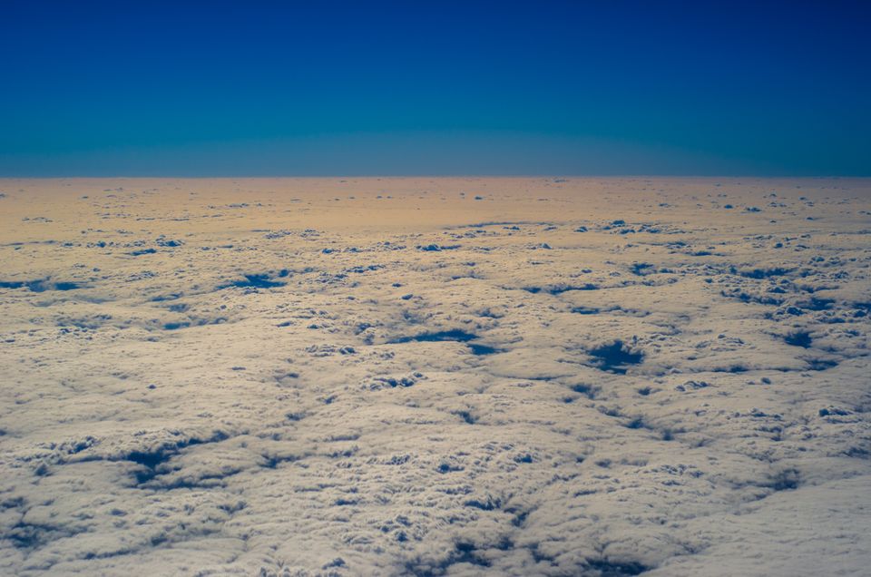High-altitude cloudscape under a clear blue sky — photo by Emiliano Arano on Pexels