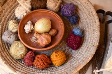 Balls of yarn coloured with onion-skin dye, photo by Rosa Stone on Pexels
