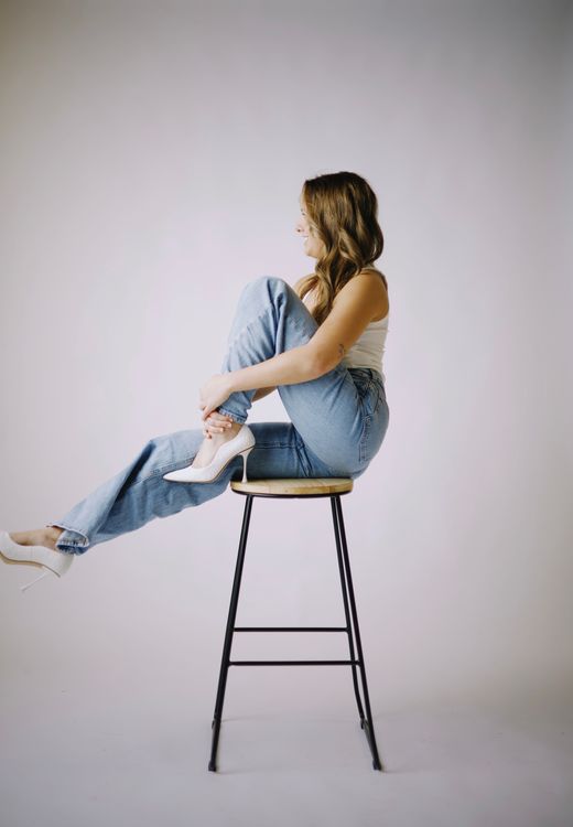 Woman In Jeans Sitting On Chair Free Stock Photo woman-in-jeans-sitting-on-chair-free-stock-photo
