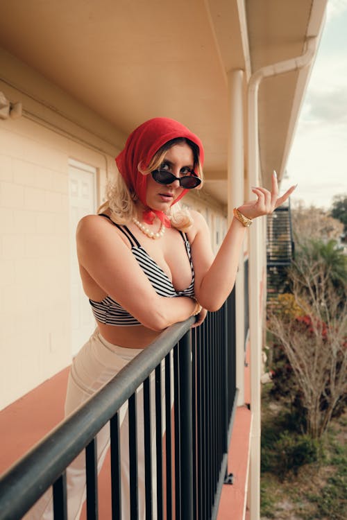 Woman in Handkerchief on Balcony